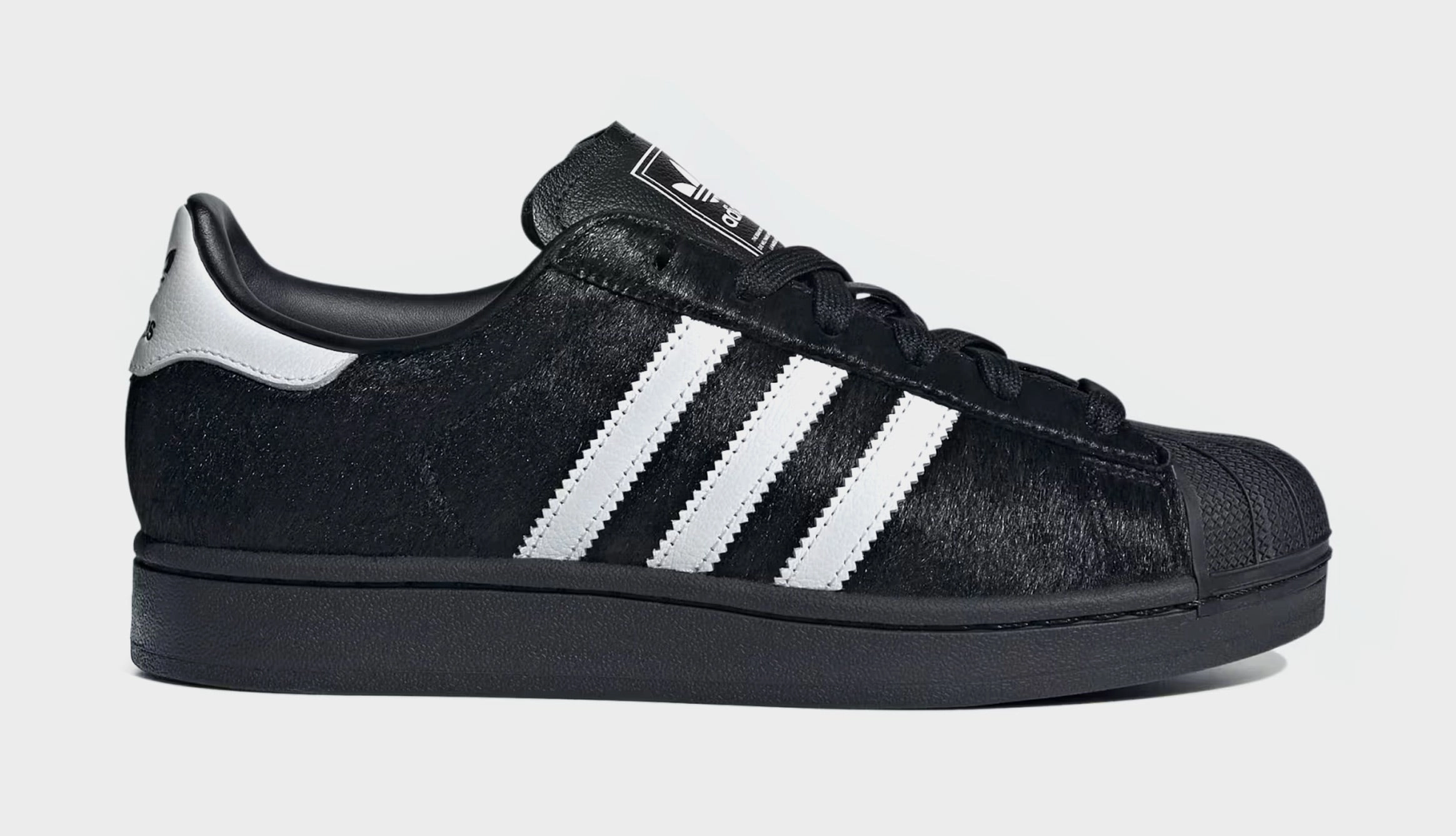 Superstar II Pony Hair Womens Lifestyle Shoes (Core Black/White) Adidas Superstar shell-toe sneakers with timeless appeal